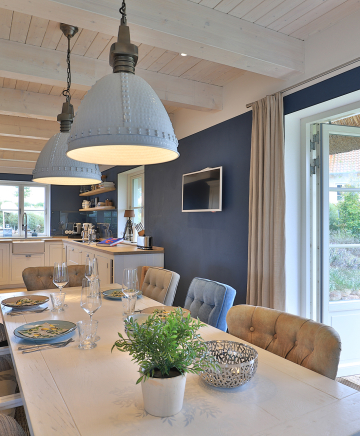 Blick auf den Essbereich im Ferienhaus Nantucket Blue in Groß Schwansee