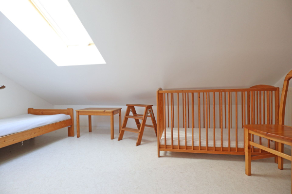 Urlauberdorf 32a - Blick in das kleine Schlafzimmer im OG