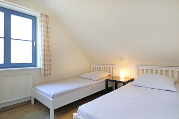 Papillon Whg. Nr. 11/8 - Blick in das Schlafzimmer auf der unterern Wohnebene