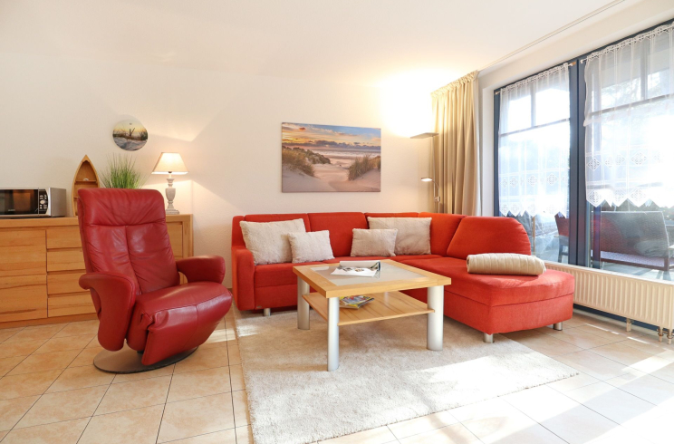 Papillon Whg. 12/4 - Blick auf den gemütlichen Wohnbereich mit Relaxsessel