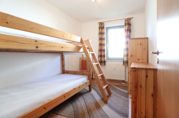 Hansehaus Whg.1 - Blick in das Schlafzimmer mit einem Etagenbett