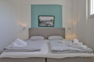 Ohlerich Speicher App. 03 - Blick in das Schlafzimmer mit einem Boxspringbett