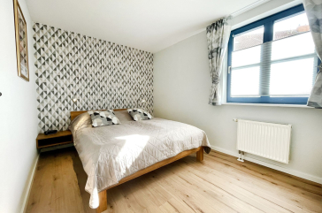 Papillon 7/1 - Blick in das Schlafzimmer mit einem Doppelbett