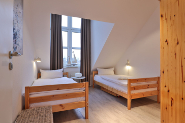 Sünnslag App.13/59 - Blick in das Kinder-/ Gästezimmer mit 2 Einzelbetten