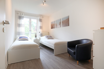 Seeschwalbe Whg. 2 - Blick in das Schlafzimmer mit zwei Einzelbetten