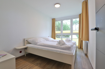 Waldfrieden Whg. 3 - Blick in das Schlafzimmer mit einem Doppelbett