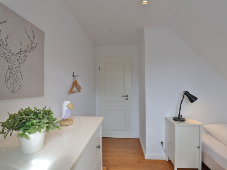 Ruhe-Insel Ferienhaus - Blick in das Schlafzimmer mir 2 Einzelbetten im OG