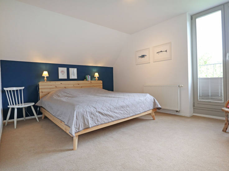 Schwanhaus - Blick in das Schlafzimmer mit einem Doppelbett