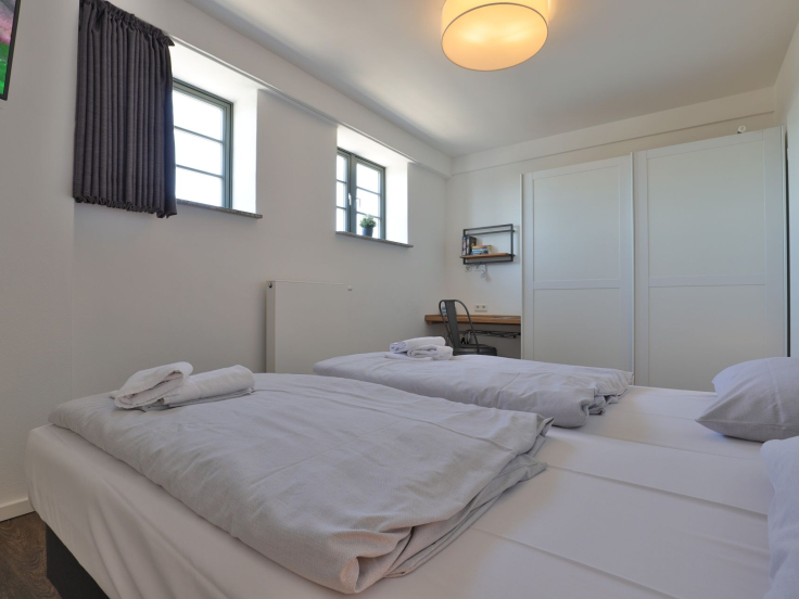 Ohlerich Speicher App. 31 - Blick in das Schlafzimmer mit einem Boxspringbett
