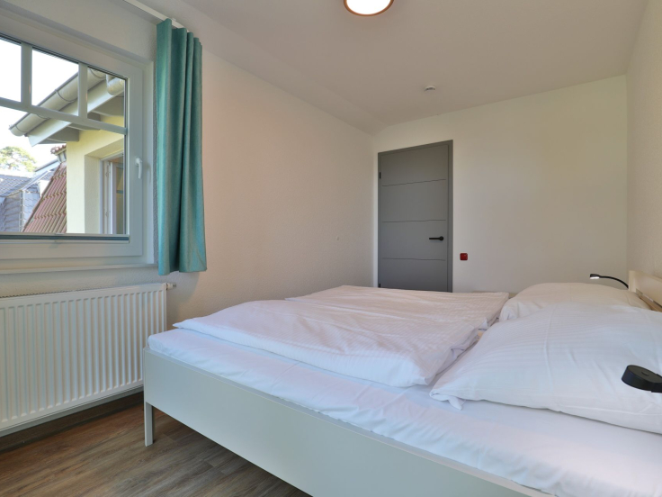Waldfrieden Whg.7 - Blick in das Schlafzimmer mit einem großen Doppelbett