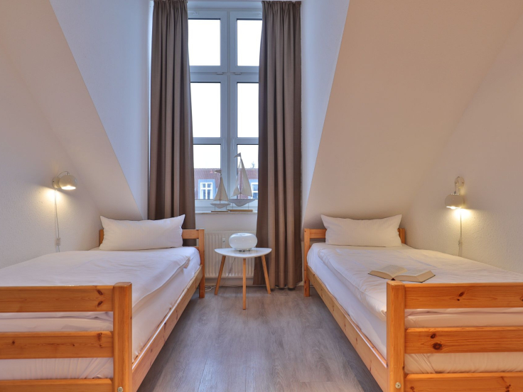 Sünnslag App.13/59 - Blick in das Kinder-/ Gästezimmer mit 2 Einzelbetten