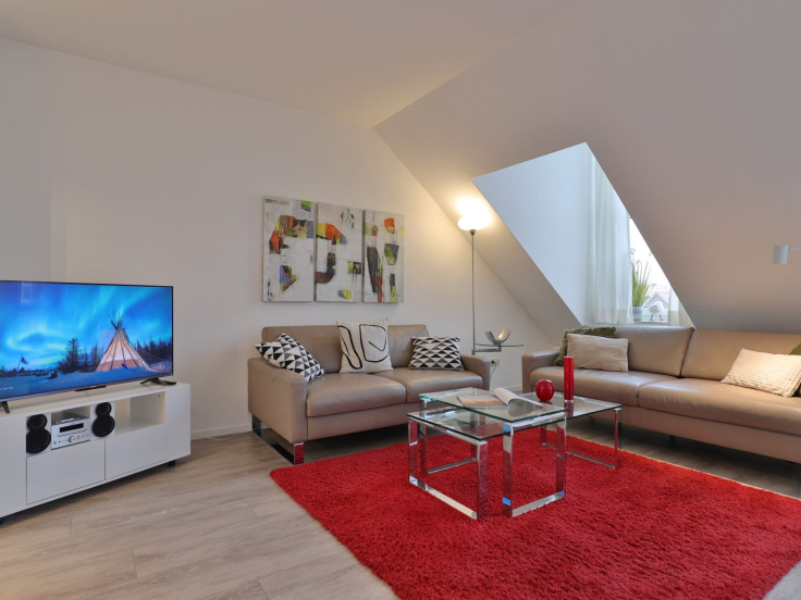 Sünnslag App.13/59 - Blick auf den offenen Wohn-/ Essbereich mit TV