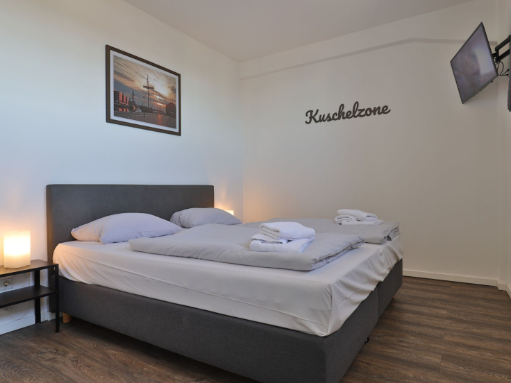 Ohlerich Speicher App. 31 - Blick in das Schlafzimmer mit einem Boxspringbett