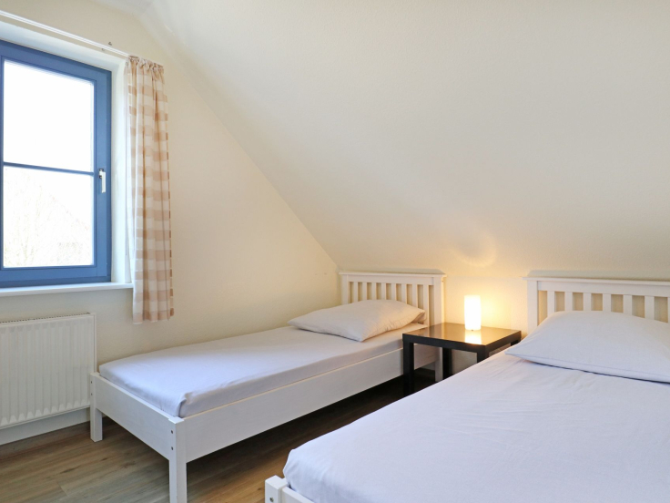 Papillon Whg. Nr. 11/8 - Blick in das Schlafzimmer auf der unterern Wohnebene