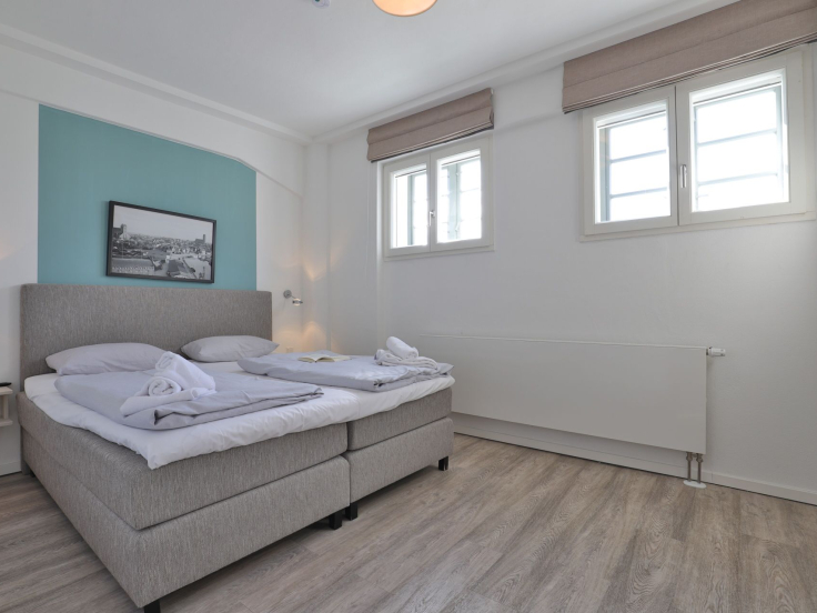 Ohlerich Speicher App. 03 - Blick in das Schlafzimmer mit einem Boxspringbett
