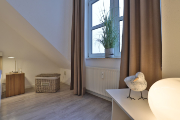 Sünnslag App.13/59 - Blick in das Schlafzimmer mit einem Doppelbett