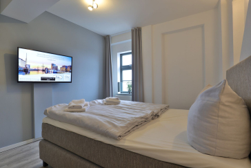Ohlerich Speicher App.45 - kleiner Schlafbereich mit Doppelbett und TV