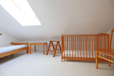 Urlauberdorf 32a - Blick in das kleine Schlafzimmer im OG